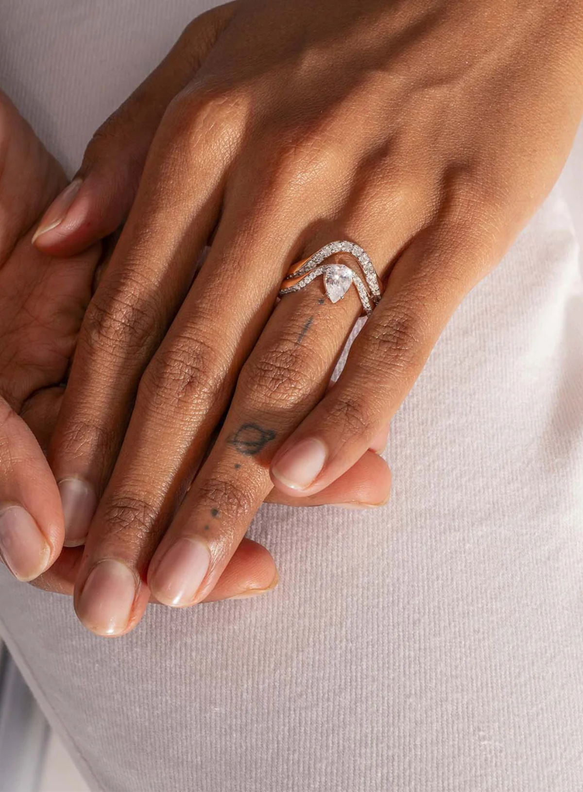 Halo Ring | Half pavé Diamonds & Pear Diamond